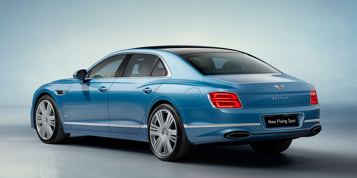 Bentley Lima New Bentley Flying Spur Azure sedan rear view in Light windsor blue by Mulliner paint with 22 inch Azure wheels and chrome exterior details