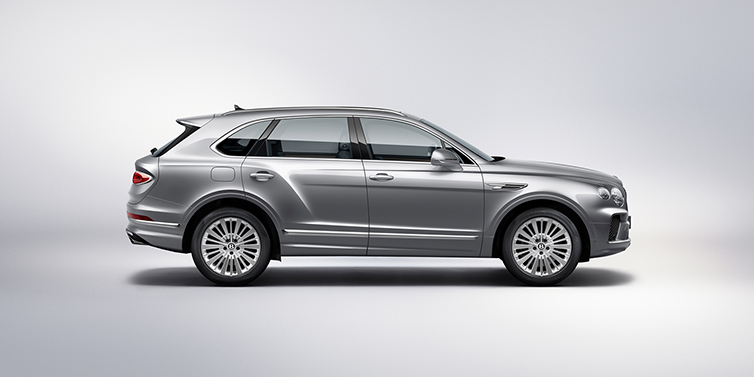 Bentley Lima Bentley Bentayga SUV side profile in Moonbeam silver paint against white background featuring 21 inch 5 spoke wheels